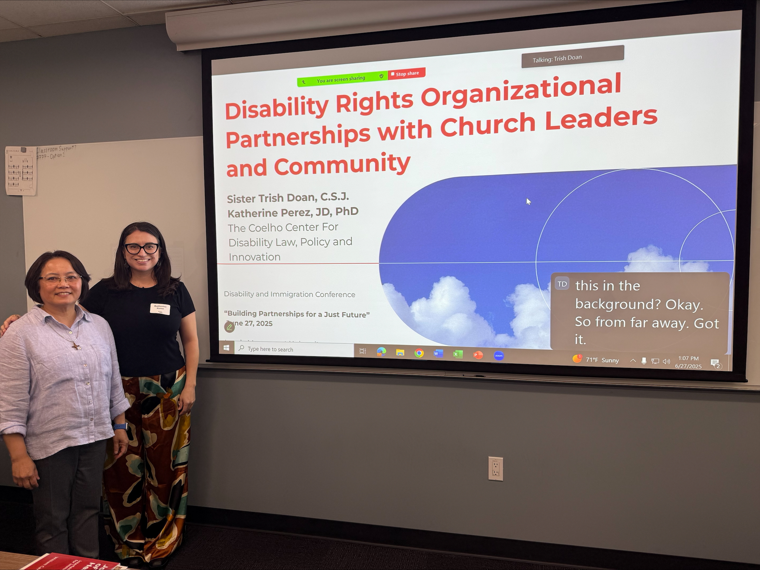 Two women standing in front of power point slide that says Disability Rights Organizational Partnerships with Church Leaders and Community